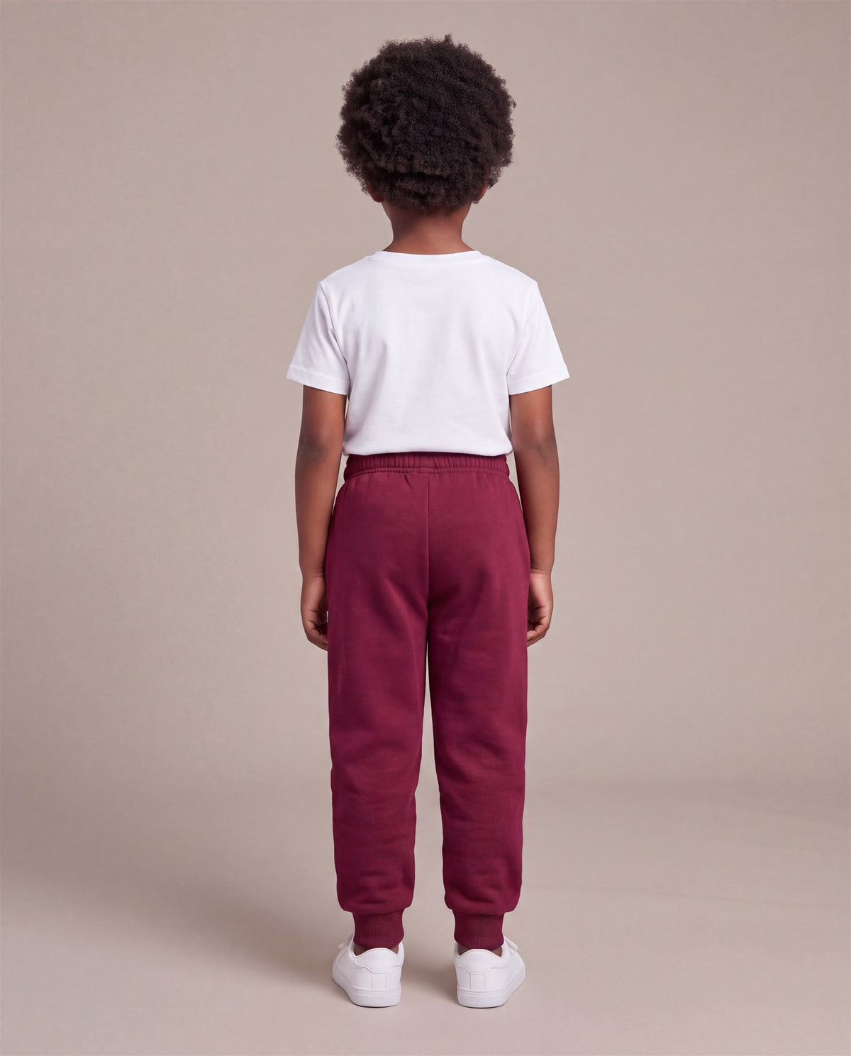Hopper burgundy kids joggers worn by a model, back