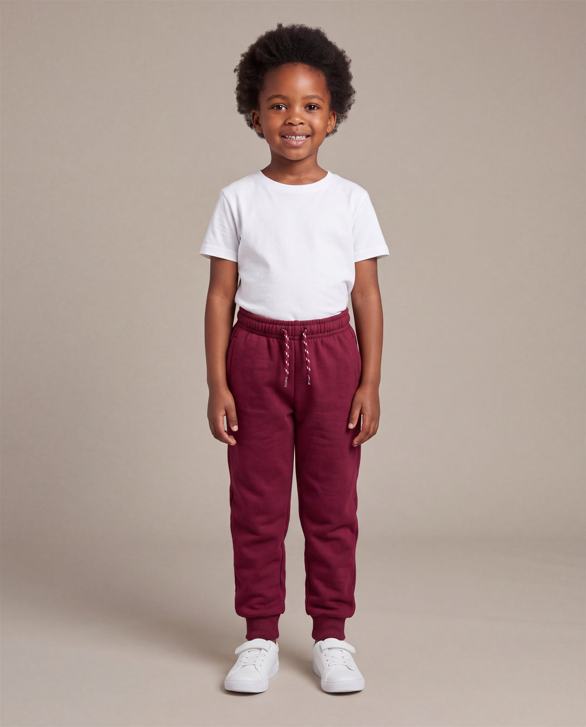 Hopper burgundy kids joggers worn by a model, front