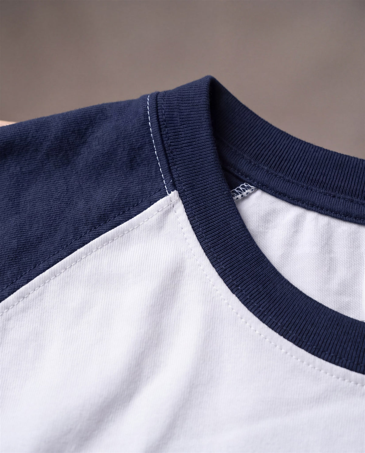 Hopper white and navy raglan t-shirt, raglan seam close-up