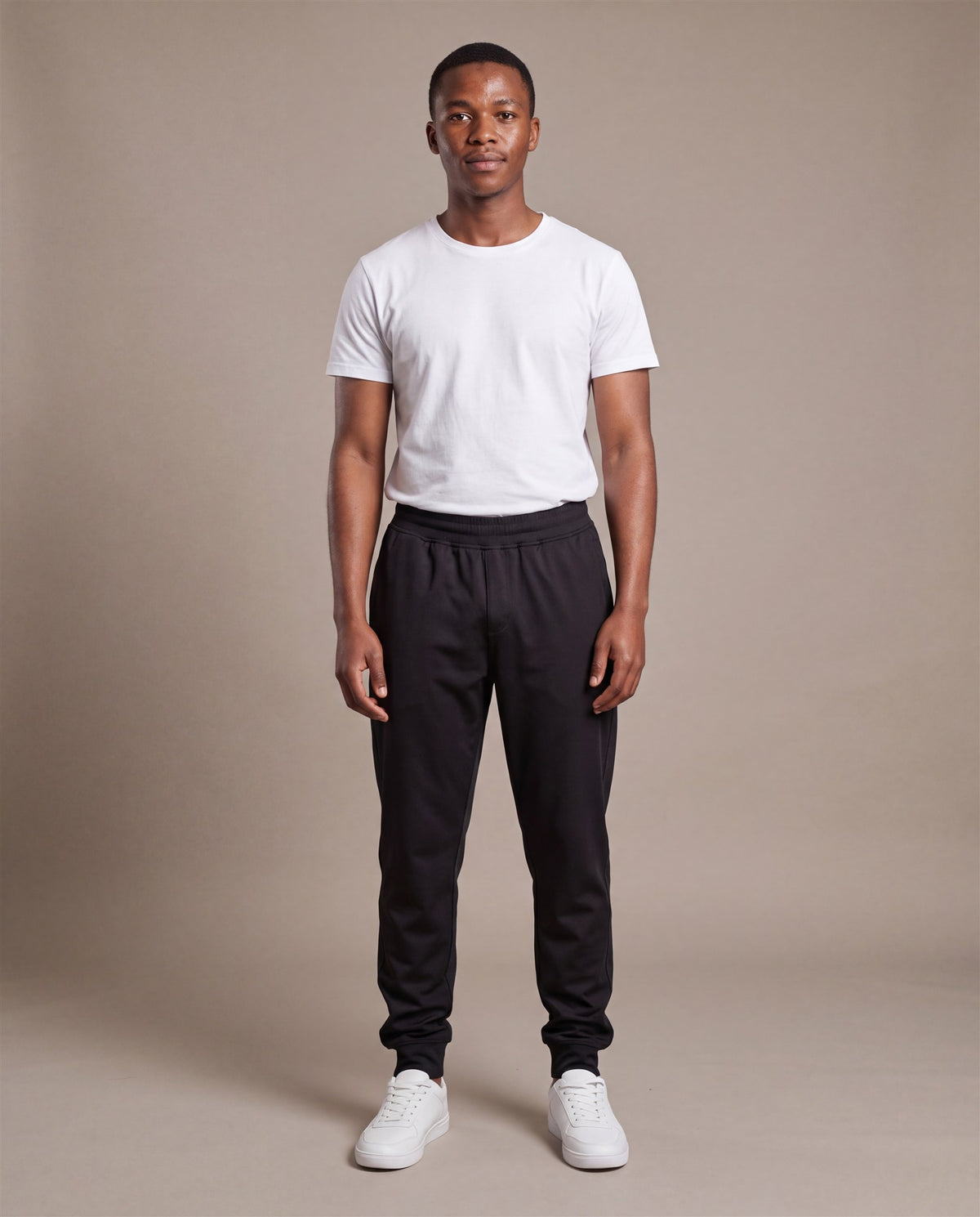 Hopper black poly track pants worn by a model, front