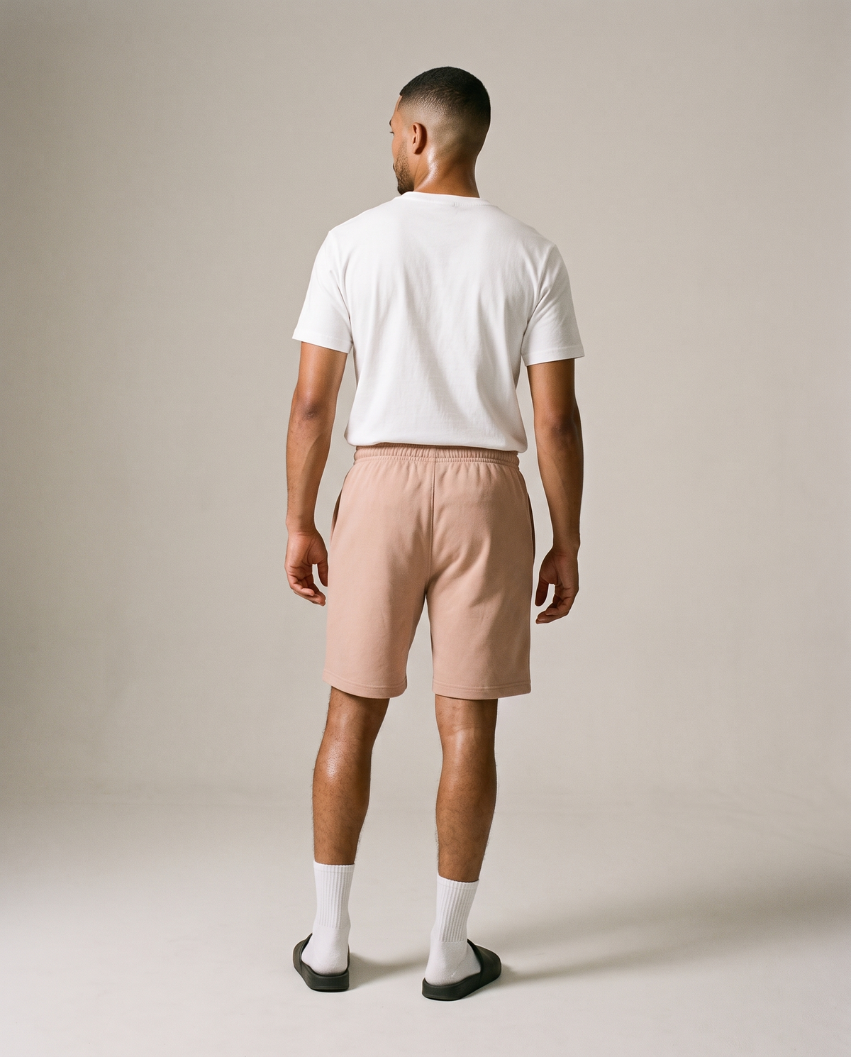 Hopper beige fleece shorts worn by a model, back view