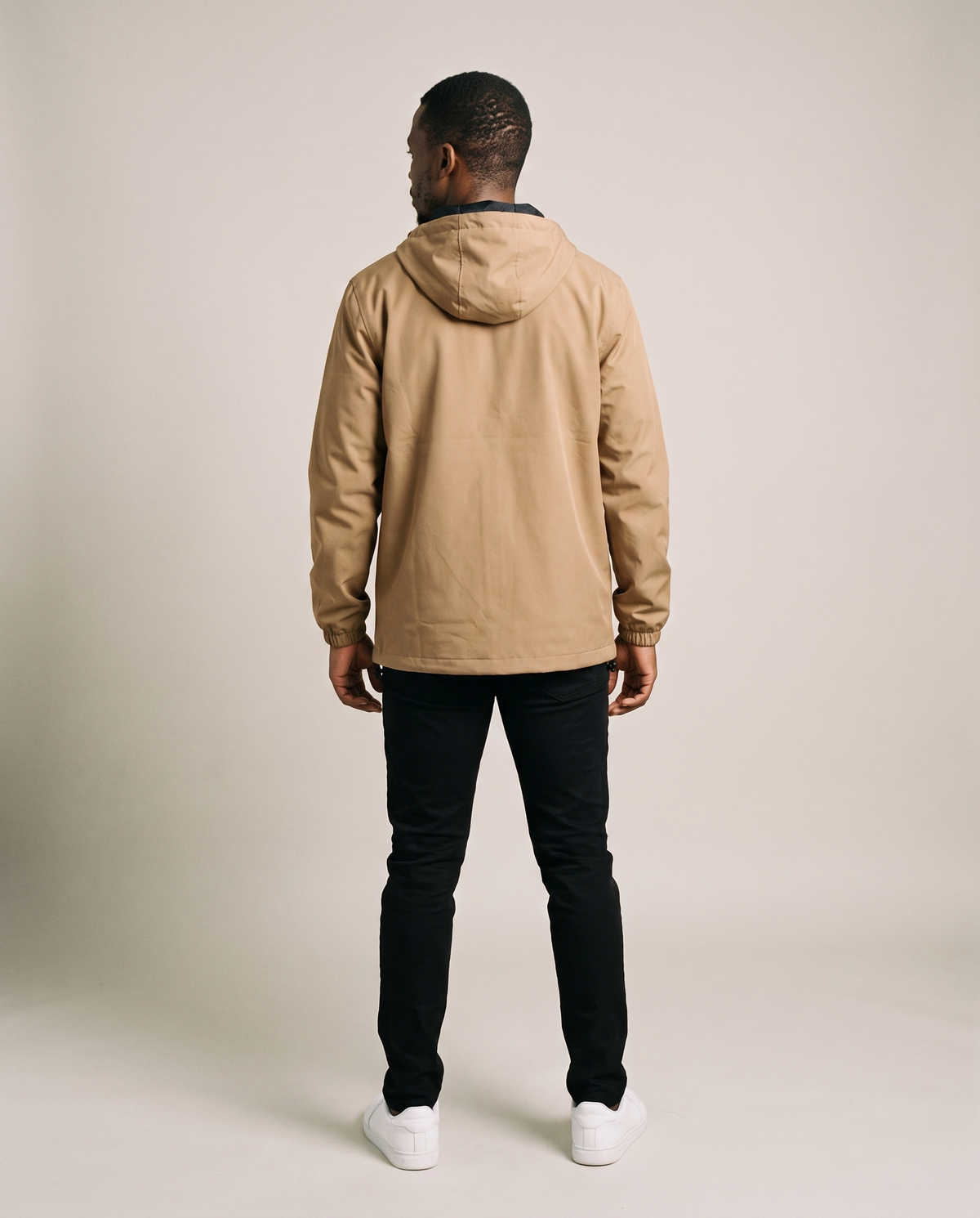 Hopper tan hooded windbreaker jacket worn by a model, back view