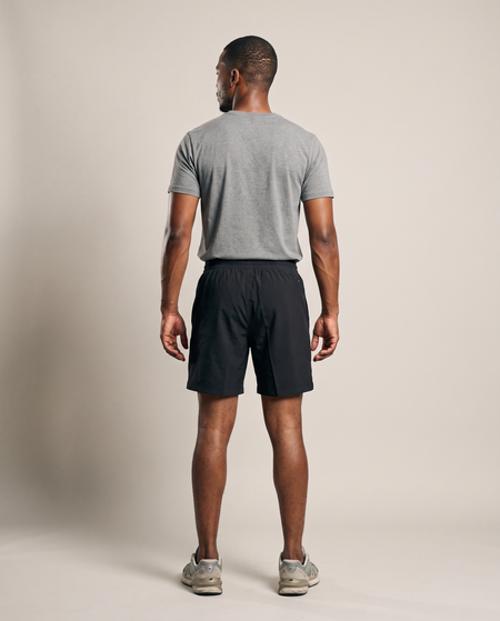 Hopper black sports shorts worn by a model, back view