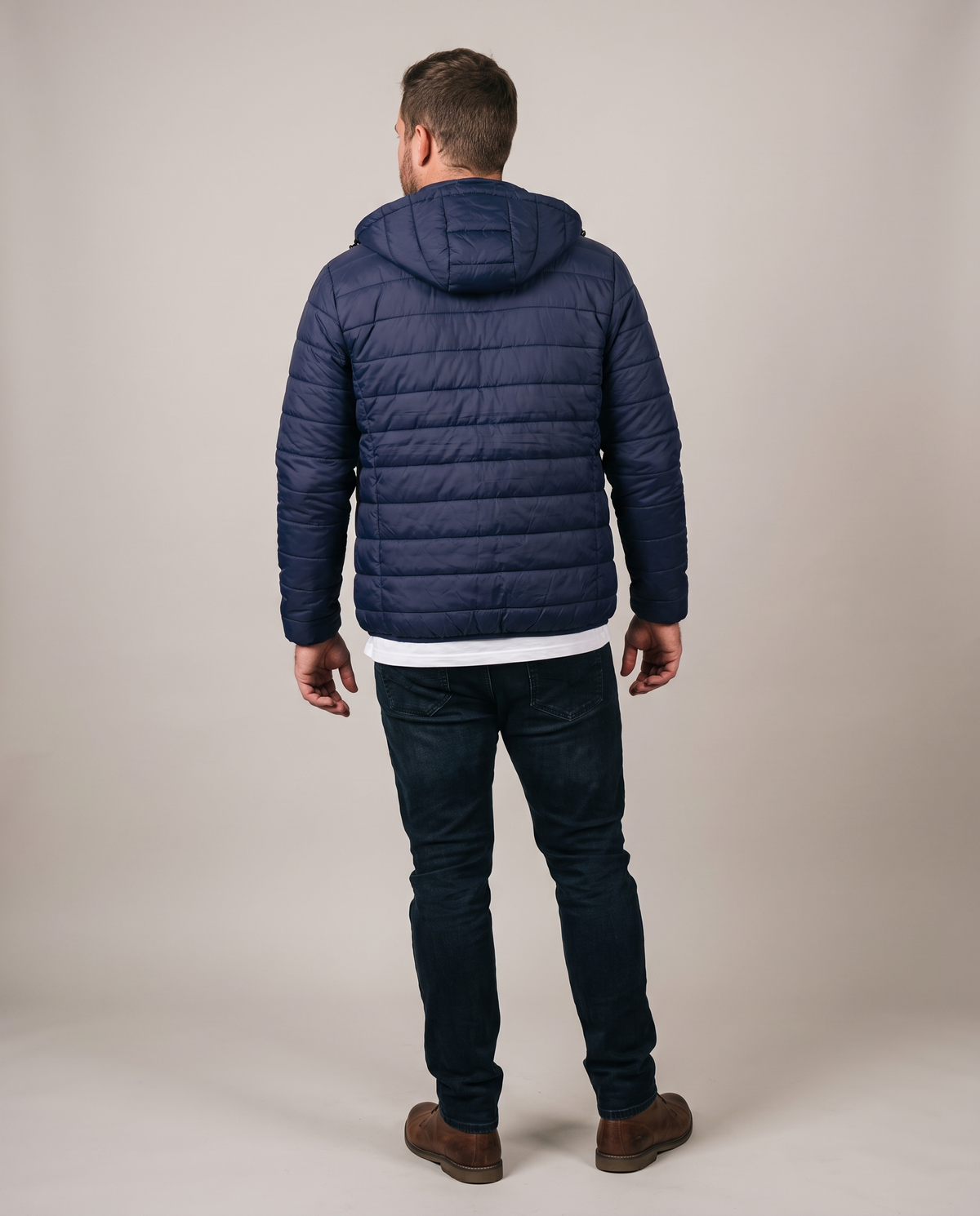 Hopper navy hooded puffer jacket worn by a model, back view