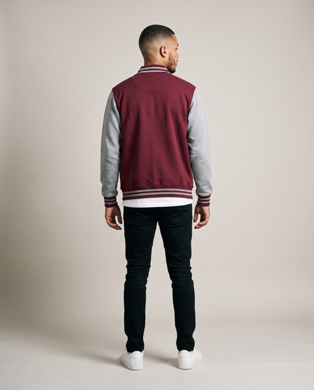Hopper burgundy and grey varsity baseball jacket worn by a model, back view