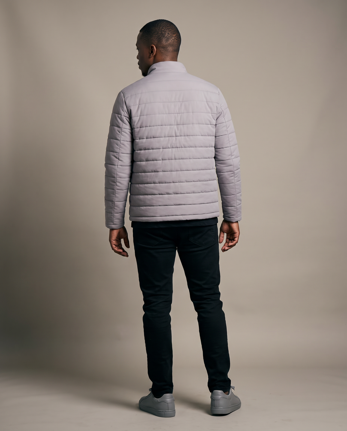 Hopper grey puffer jacket without hood worn by a model, back view