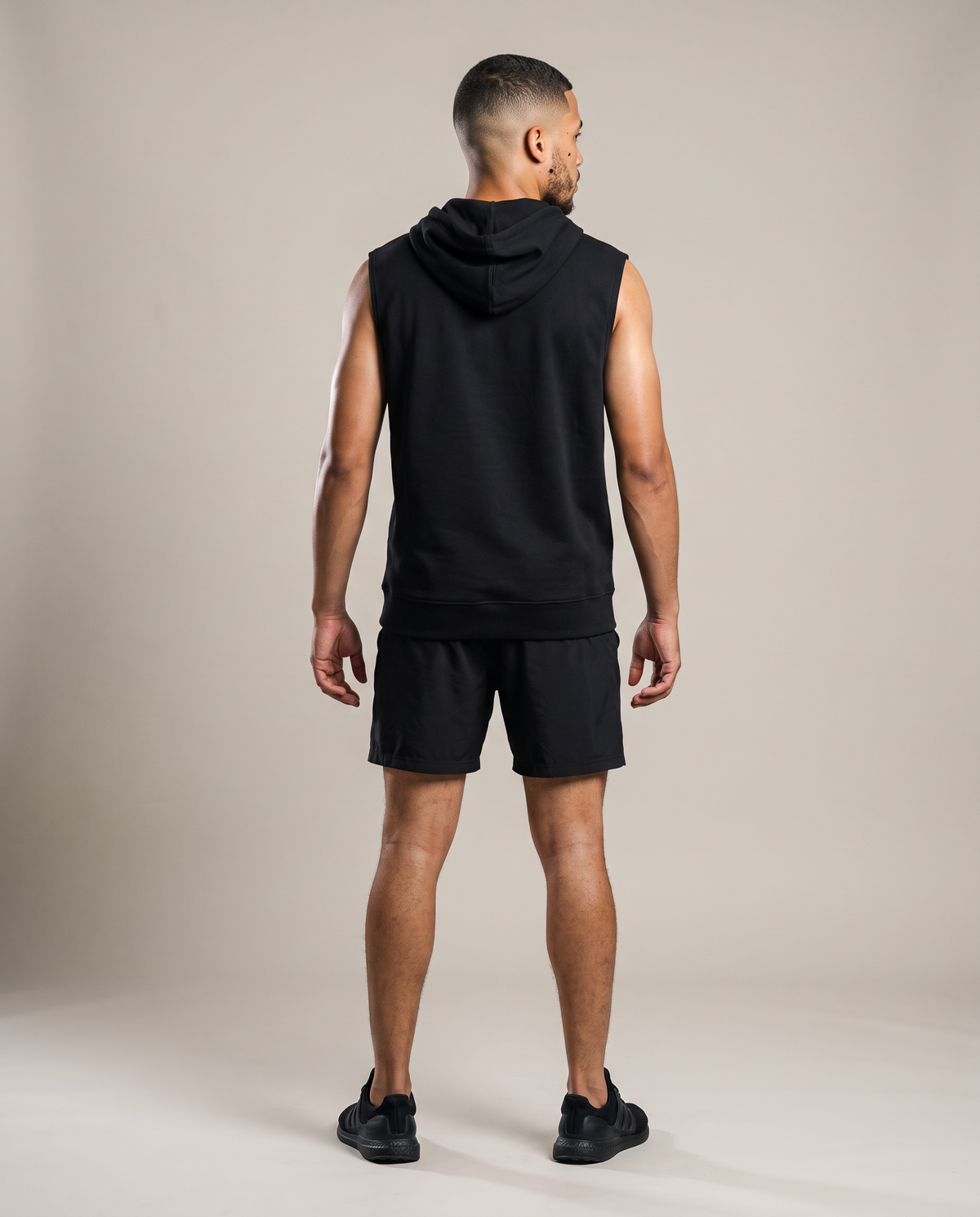 Hopper black sleeveless hoodie worn by a model, back view