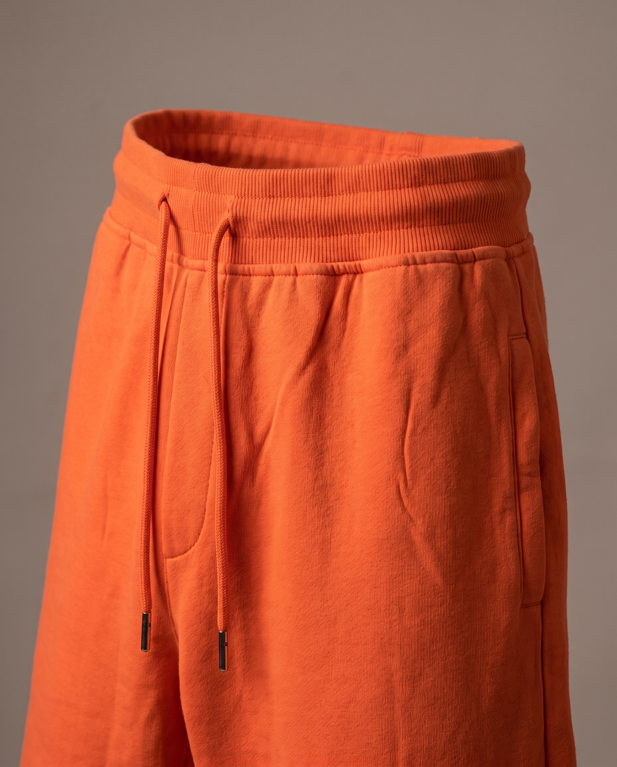 Hopper orange fleece track pants, fabric and construction close-up