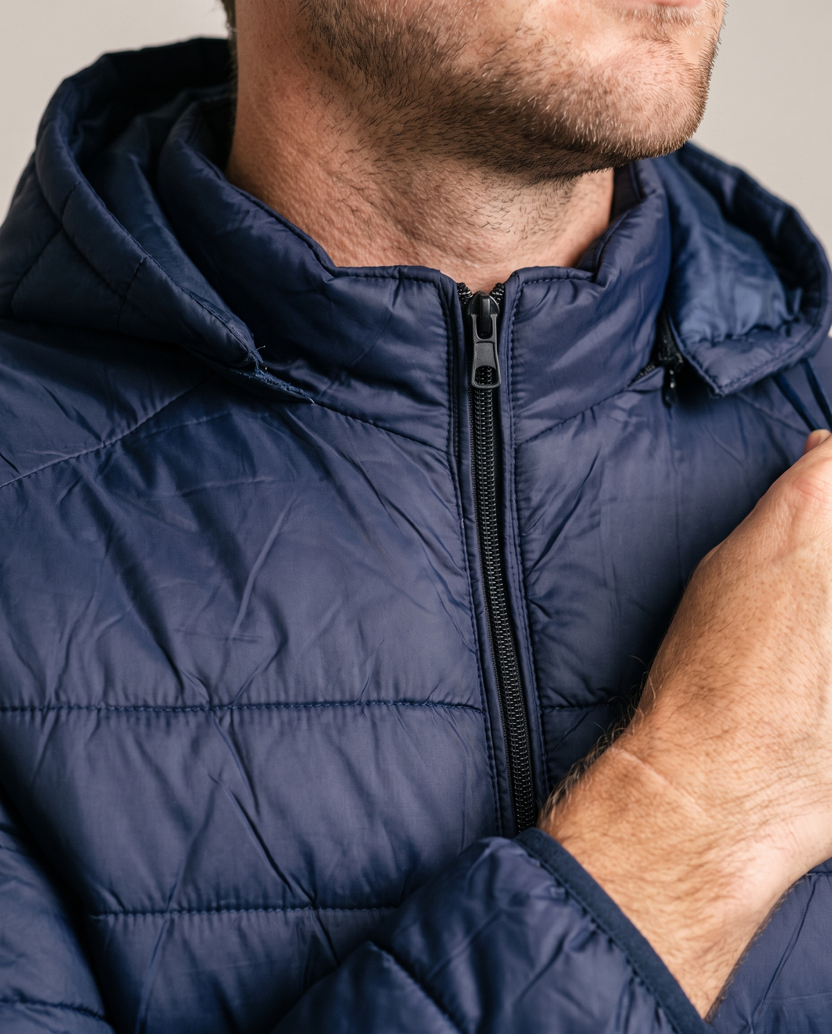 Hopper navy hooded puffer jacket, fabric and construction close-up