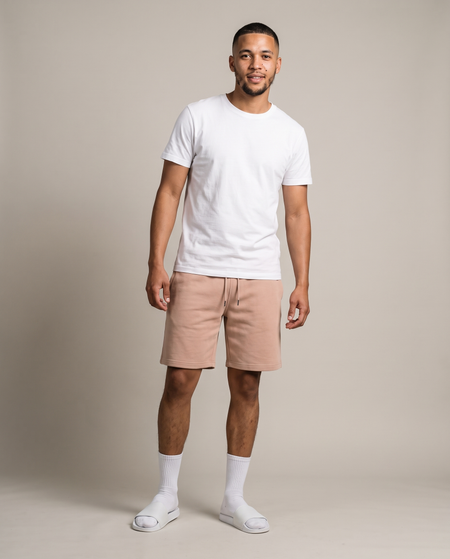 Hopper beige fleece shorts worn by a model, front view