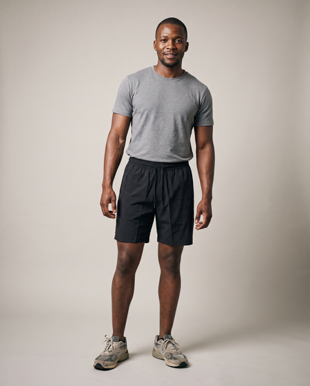 Hopper black sports shorts worn by a model, front view