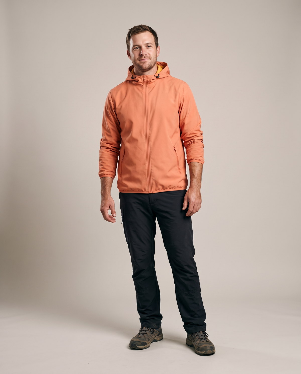 Hopper orange waterproof jacket worn by a model, front view
