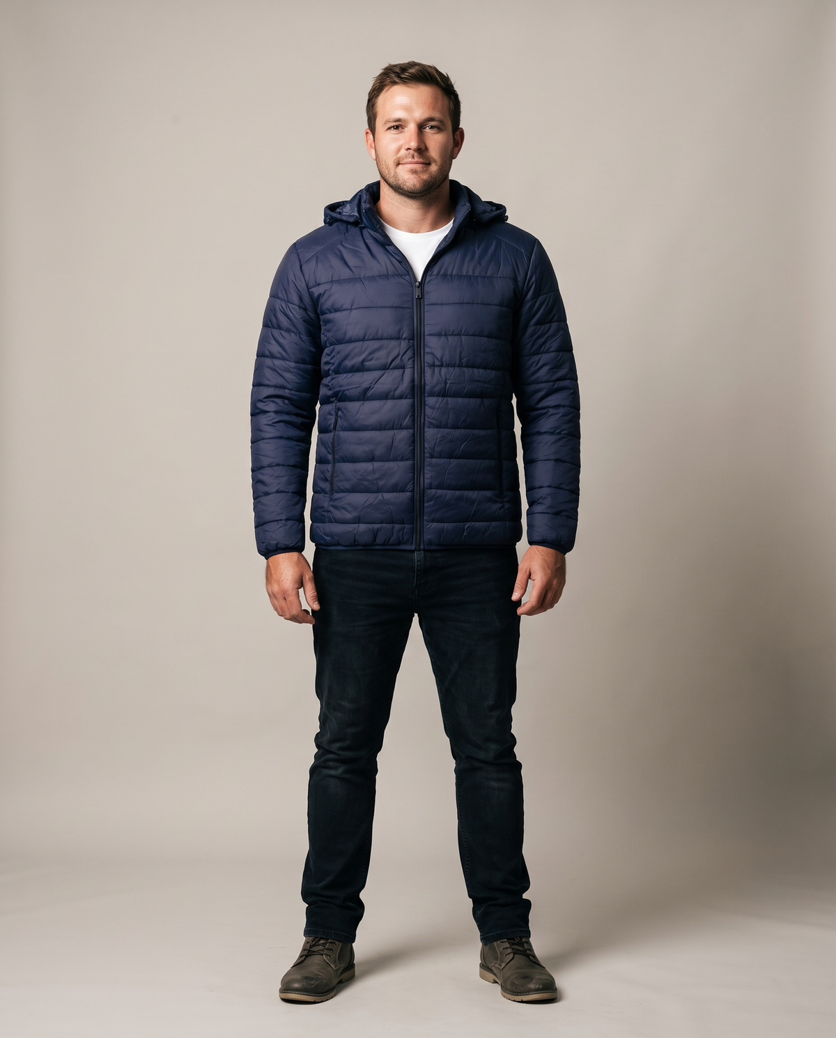 Hopper navy hooded puffer jacket worn by a model, front view